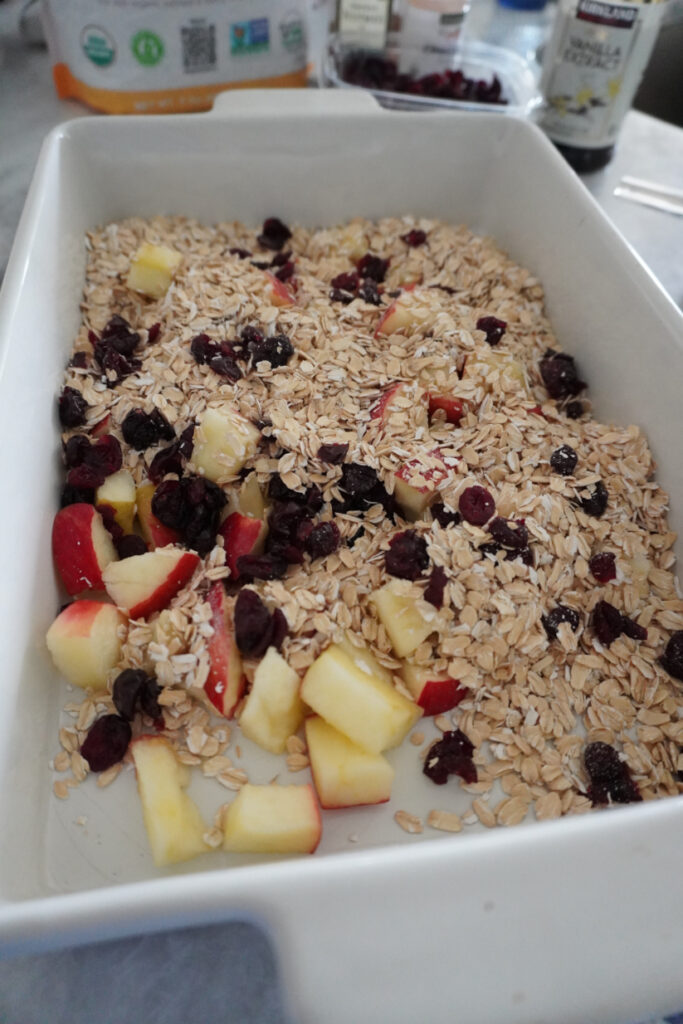dry ingredients for baked apple cinnamon oatmeal in a baking dish