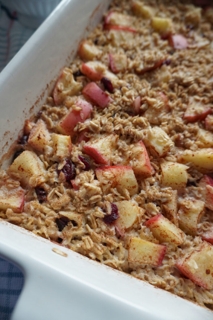 a closeup of tender apple chunks in a baked apple cinnamon oatmeal