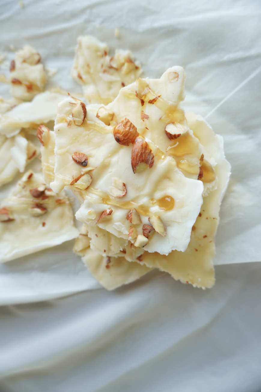 maple salted almond yogurt bark pieces in a stack