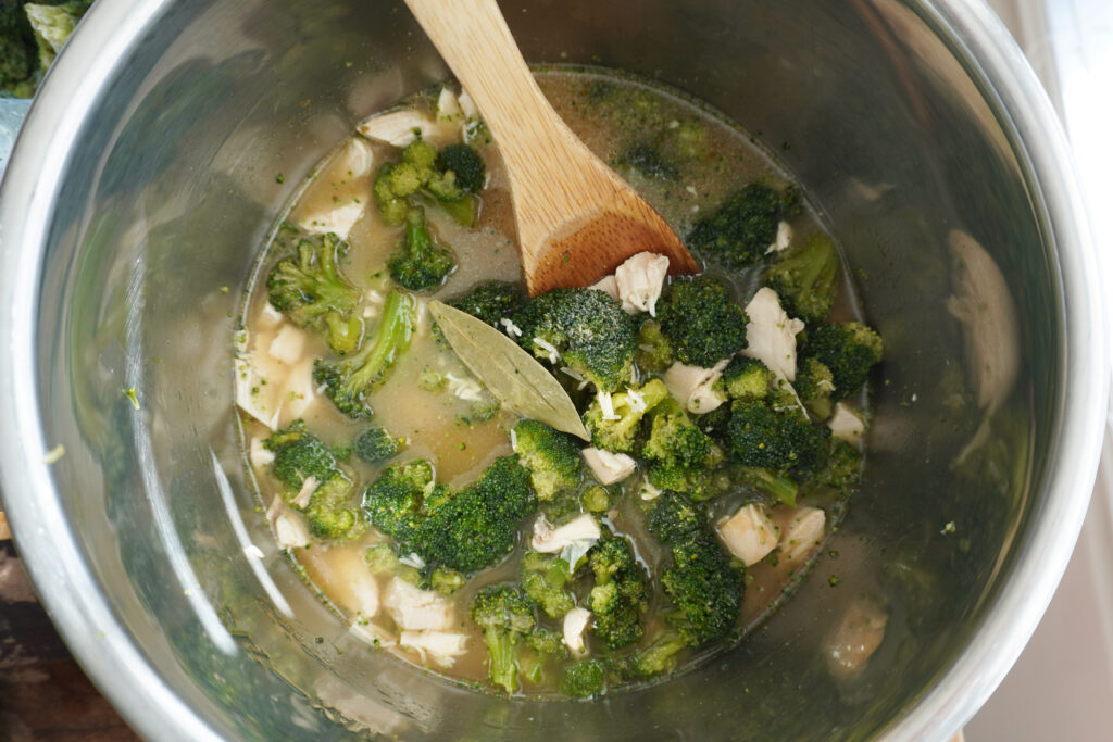ingredients for chicken broccoli rice casserole in the Instant pot before cooking