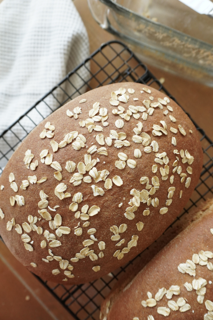 baked loaves of brown bread on a cooling rack